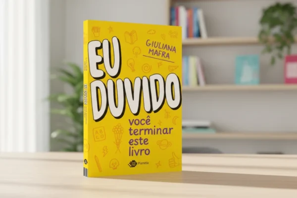 Capa do livro "Eu duvido você terminar este livro" em uma mesa de madeira clara.